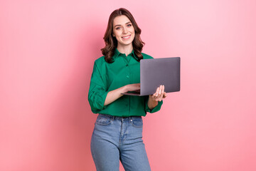 Photo of pleasant satisfied nice woman with wavy hairdo dressed green shirt hold laptop while...