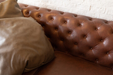 Sofa Chester in an interior. seat leather sofa. Selective focus.