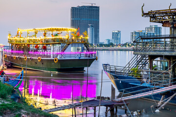 Floating nightclubs and pleasure boats,illuminated after sunset,Phnom Penh,Cambodia.
