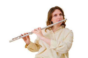 A woman with a flute is playing at home on the sofa in the living room, isolated on a white...