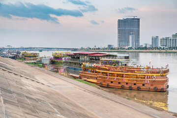 Floating nightclubs and pleasure boats,illuminated after sunset,Phnom Penh,Cambodia.