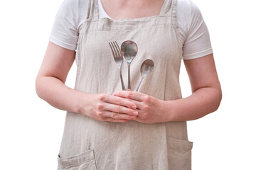 Spoons and forks in the hands of a woman in the kitchen, isolated on a white background. Women's...