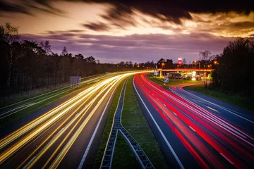 Tuinposter traffic on highway at night © hansenn