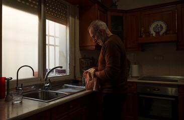Adult man in domestic kitchen
