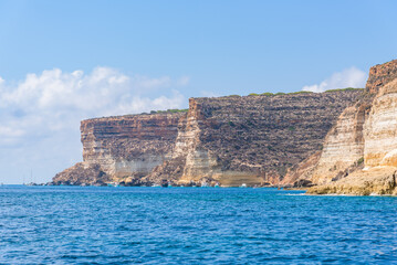 Fototapeta na wymiar Limestone cliffs in the south coast of the island of Lampedusa, Sicily, Italy.