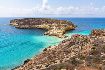 Obraz premium Isola dei Conigli (Rabbit Island) and its beautiful beach with turquoise sea water. Lampedusa, Sicily, Italy.
