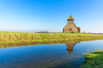 St Thomas à Becket Church in Fairfield, Kent, on a sunny day.