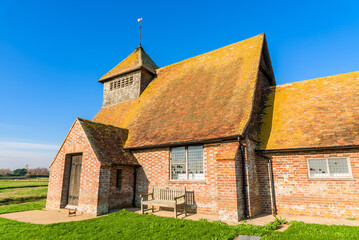 St Thomas à Becket Church in Fairfield, Kent, on a sunny day.