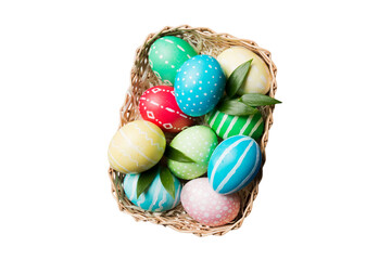 Basket of colorful Easter eggs isolated on white background. Easter basket filled with colored eggs top view holiday concept