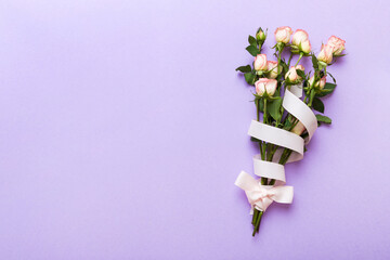 Bouquet of pinkand white roses on colored background. Mother's day, Valentines Day, Birthday celebration concept. Greeting card. Copy space for text, top view