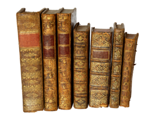 Row of antique books with a leather cover and golden ornaments on isolated on white background