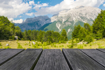 Empty wooden table with beautiful landscape background