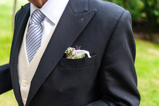 Pinned to the groom's lapel