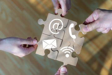 Business strategy icon on jigsaw puzzle. Website and Internet contact us page concept with phone,...
