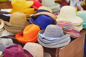 Straw hats on street market in Cucuron, Provence, France - obrazy, fototapety, plakaty