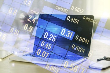 Multi exposure of creative statistics data hologram on laptop background, stats and analytics concept