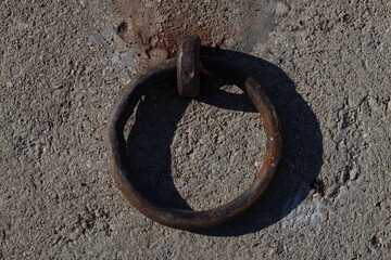 rusty ring for mooring of ships in a harbor