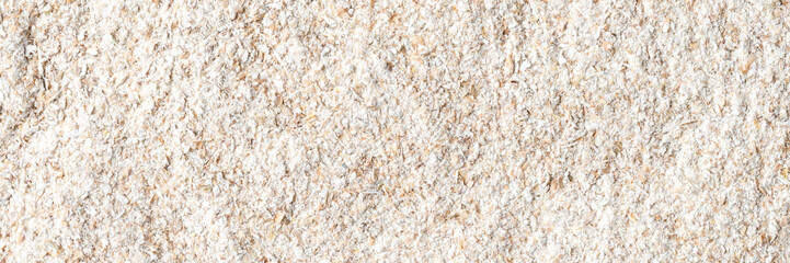 Whole grain flour texture. Background with copyspace. Close up. Top view
