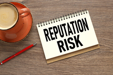 Reputation risk orange cup of coffee with notepad with text