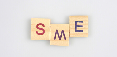Wooden cube with the letter from word
