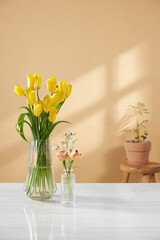 A cozy home with sunlight shining through the
windows and fresh flowers