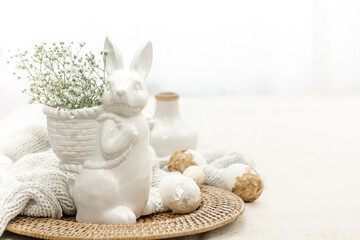 Easter composition with a ceramic hare and eggs.
