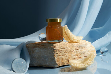 Some raw edible bird’s nest and a glass bottle containing bird’s nest water unlabeled placed on...