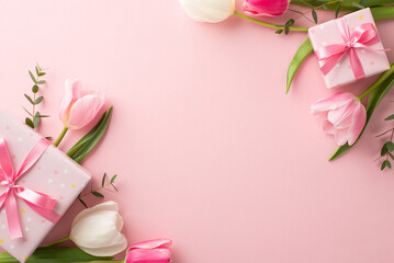 Obraz na płótnie Canvas Mother's Day decorations concept. Top view photo of trendy gift boxes with ribbon bows and tulips on isolated pastel pink background with copyspace