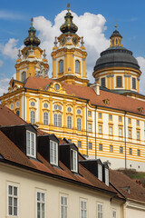View of Melk Abbey with Collegiate Church towers on background of blue sky, Melk, Austria