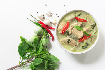 Chicken curry is the original food culture of Thailand in bowl on white wood background.