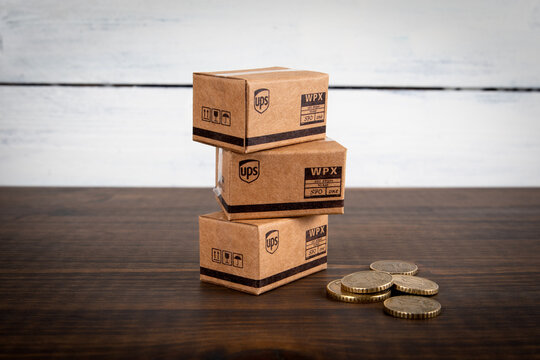UPS cardboard packaging boxes in stack. Mail and parcel delivery