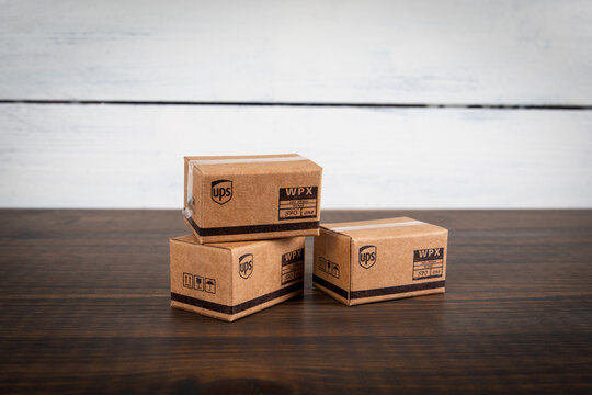 UPS cardboard packaging boxes in stack. Mail and parcel delivery