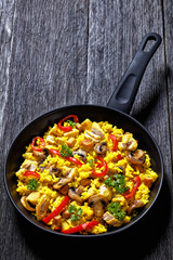 Chicken Paella with mushrooms, red pepper, spices