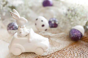 Fototapeta na wymiar Festive Easter background with decorative ceramic hare.