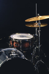 Naklejka na ściany i meble Snare drum on a blurred dark background, part of a drum kit.