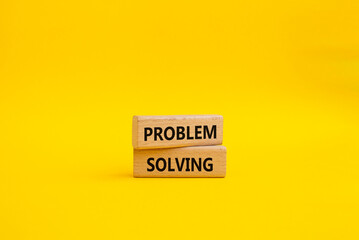 Problem solving symbol. Concept word Problem solving on wooden blocks. Beautiful yellow background. Business and concept. Copy space