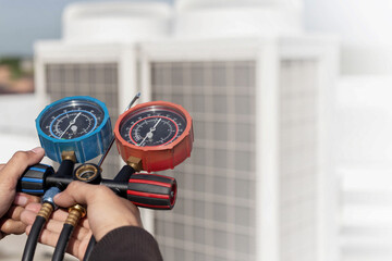 Technician checking the operation of the air conditioner	