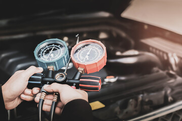 Car maintenance and service Auto mechanic Use a manifold gauge. Check refrigerant and refill car...