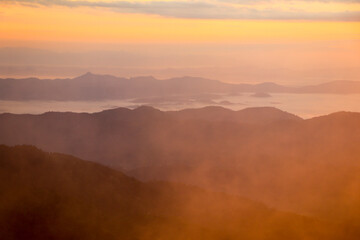 Beautiful Landscape In The Mountains At Sunrise.Foggy Mountain Landscape Warm Tone Photo