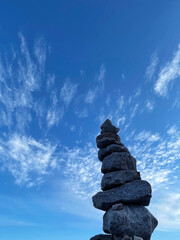 Pyramid of stones against the sky, the concept of balance.