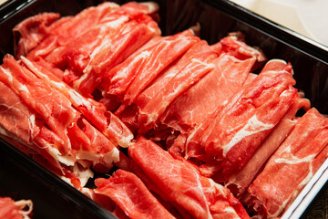 Fresh raw meat, thinly sliced