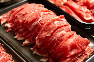 Fresh raw meat, thinly sliced
