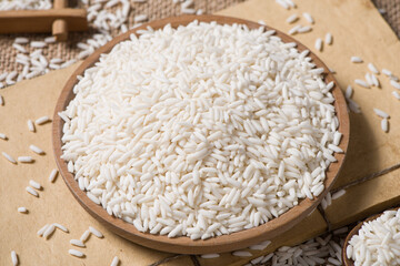 Organic raw sticky rice or glutinous rice  on table