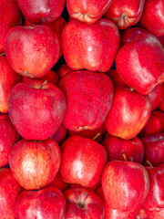 Fresh, organic red apples top view closeup. Sweet and juicy vegan food.