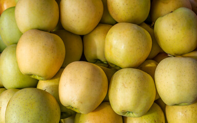 Fresh, organic green apples top view closeup. Sweet and juicy vegan food.