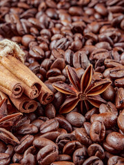 Antique vintage retro bronze coffee mill on black wooden board with roasted coffee beans