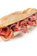 Spanish serrano ham sandwich isolated on white background. Close up
