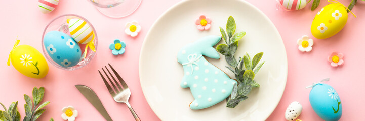 Easter food background with holiday decorations. Easter table setting. Flat lay long format.