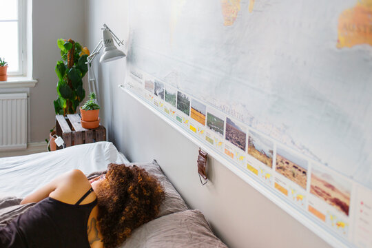 Woman lying down in bed