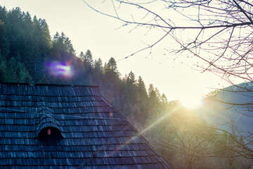 Sunset in the Ukrainian Carpathians. Ukrainian mountain village. Horizontal. Place for text.
